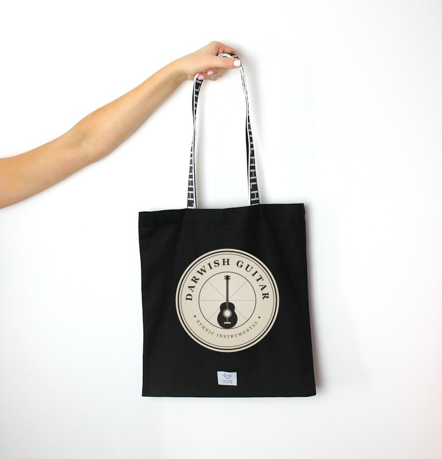 Black tote bag with the Darwish Guitar emblem